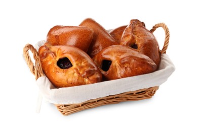 Photo of Wicker basket with delicious baked patties on white background