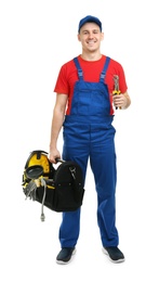 Young plumber with tool bag on white background