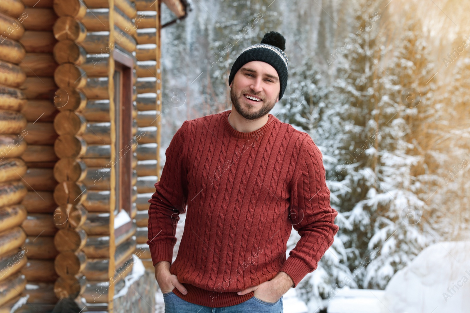 Photo of Happy man in warm sweater outdoors on winter day