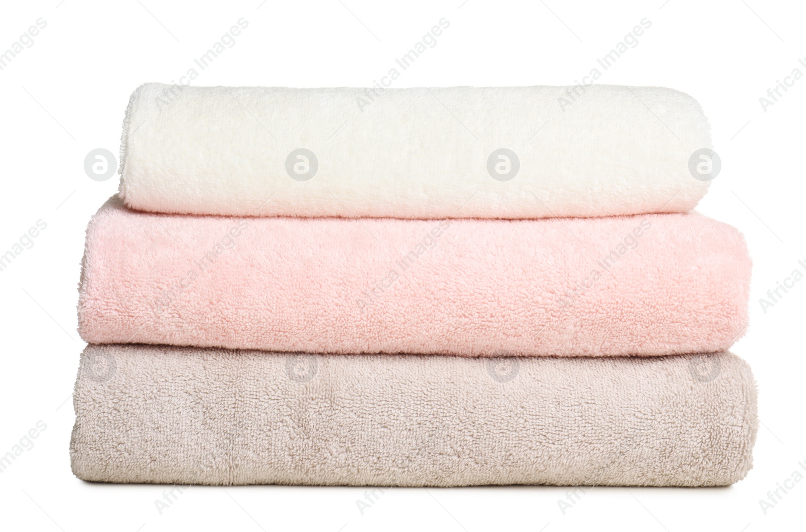 Photo of Folded soft terry towels on white background