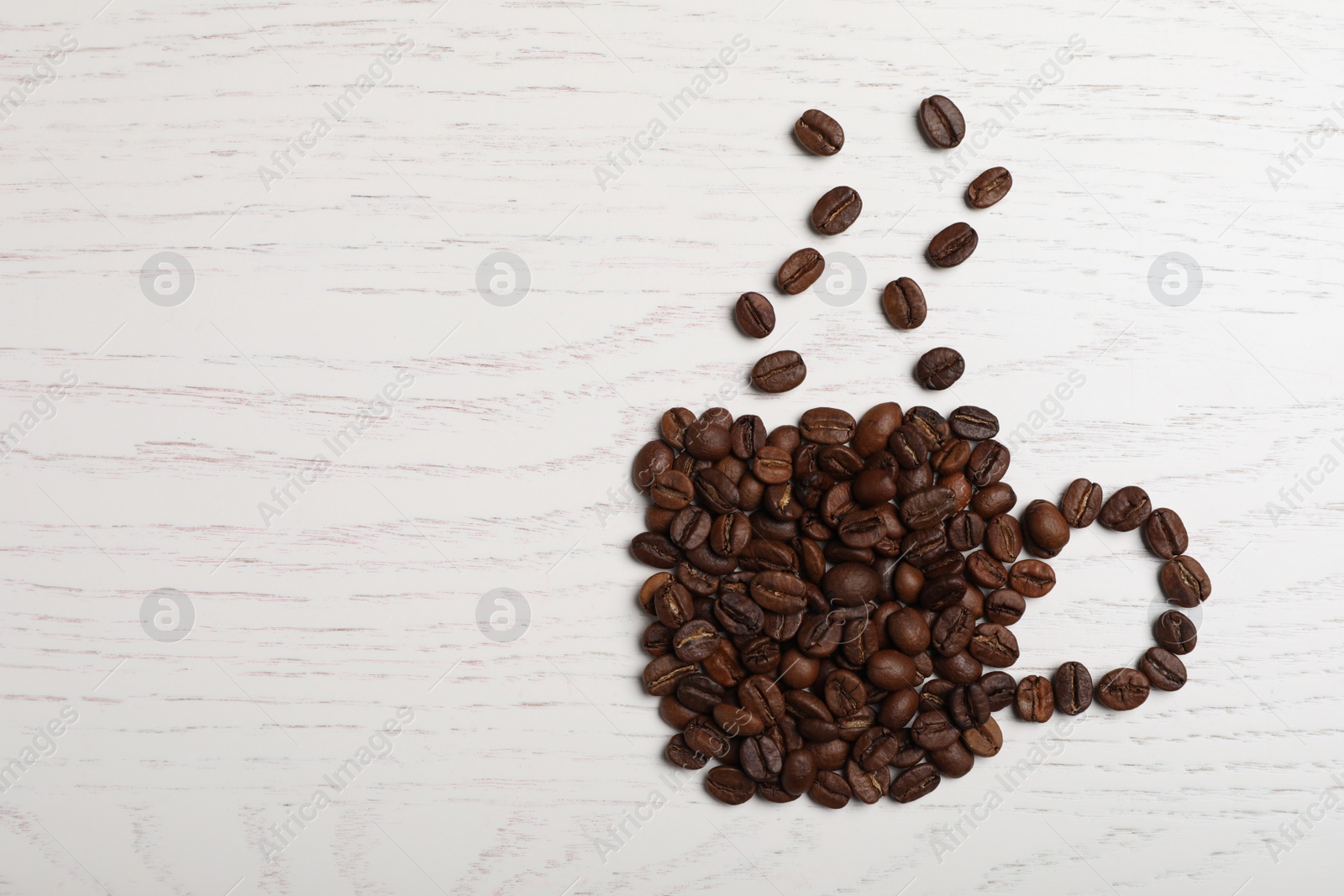 Photo of Cup made of beans on white wooden table, flat lay with space for text. Coffee Break