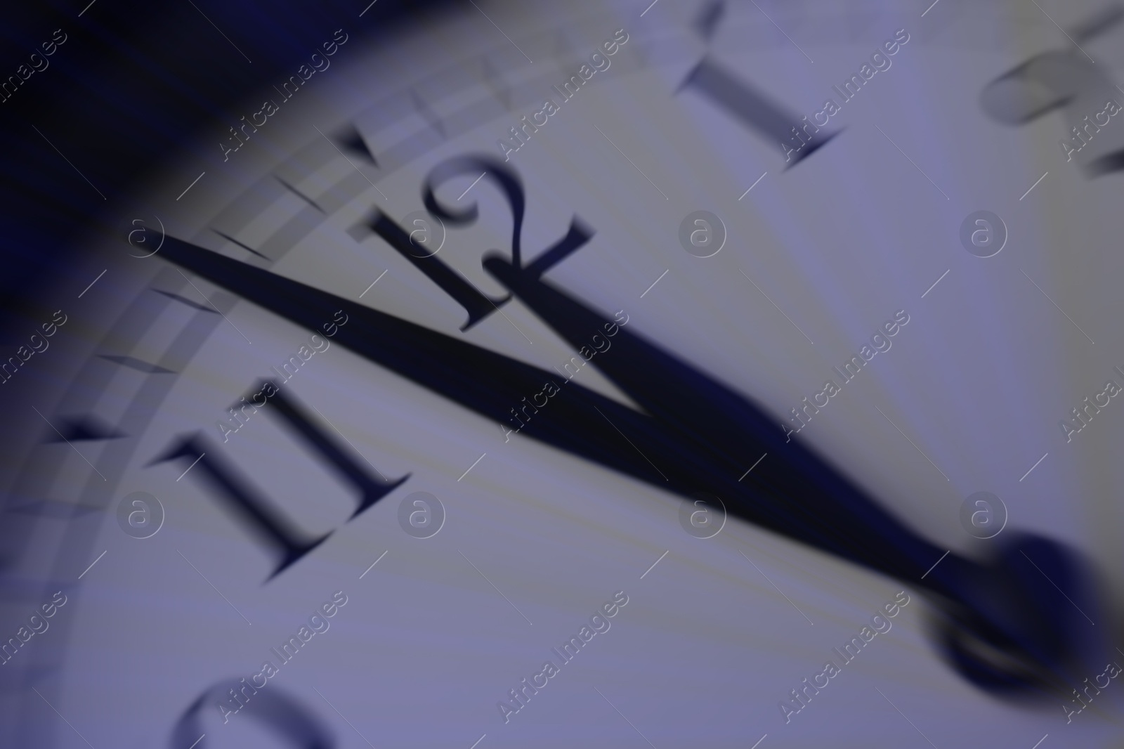 Image of Closeup view of clock, motion blur effect. Time concept