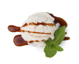 Scoop of ice cream with caramel sauce and mint isolated on white, top view