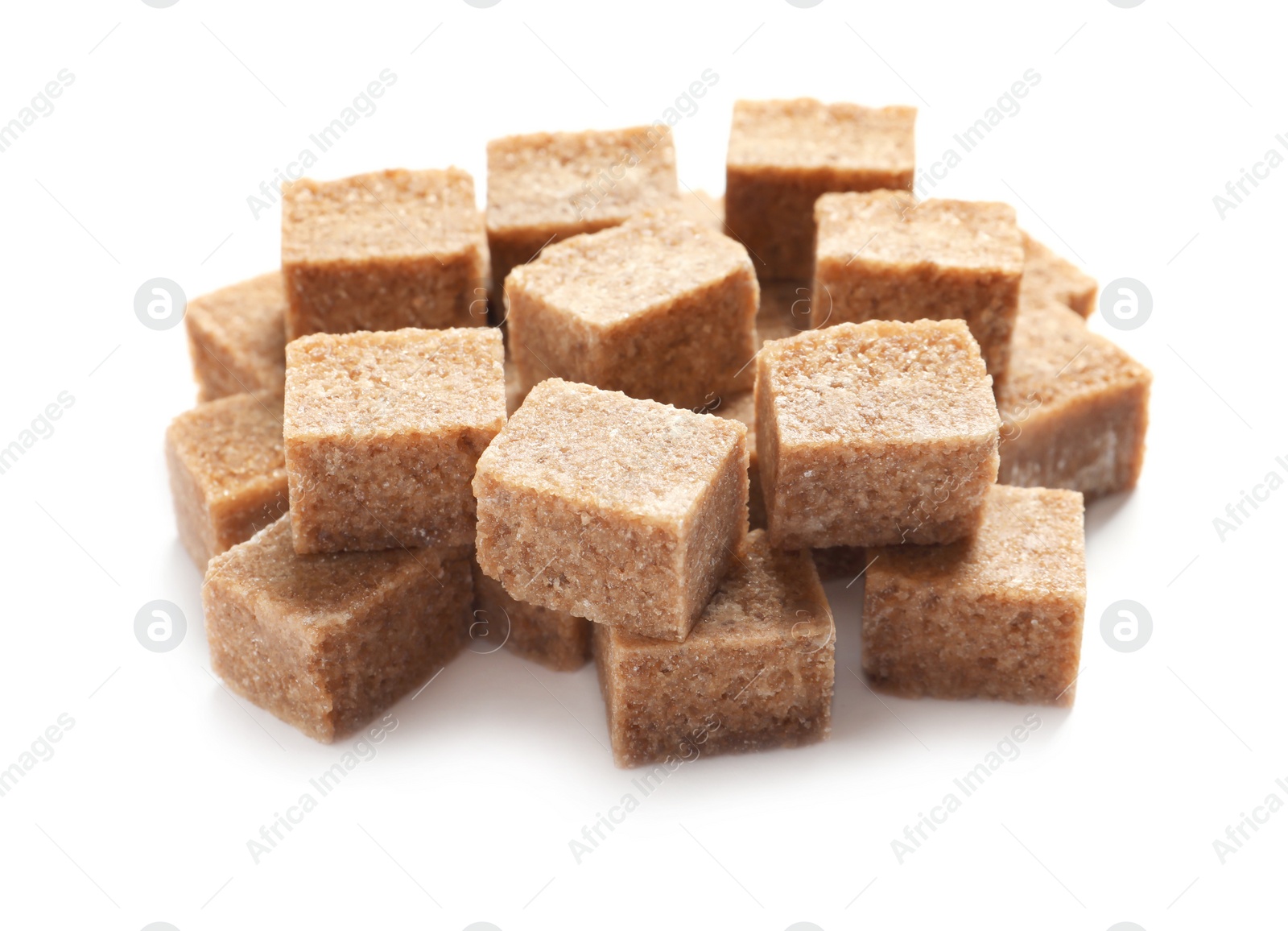 Photo of Cubes of brown sugar on white background