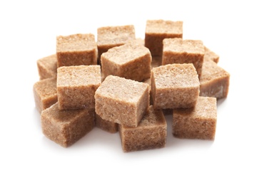 Photo of Cubes of brown sugar on white background