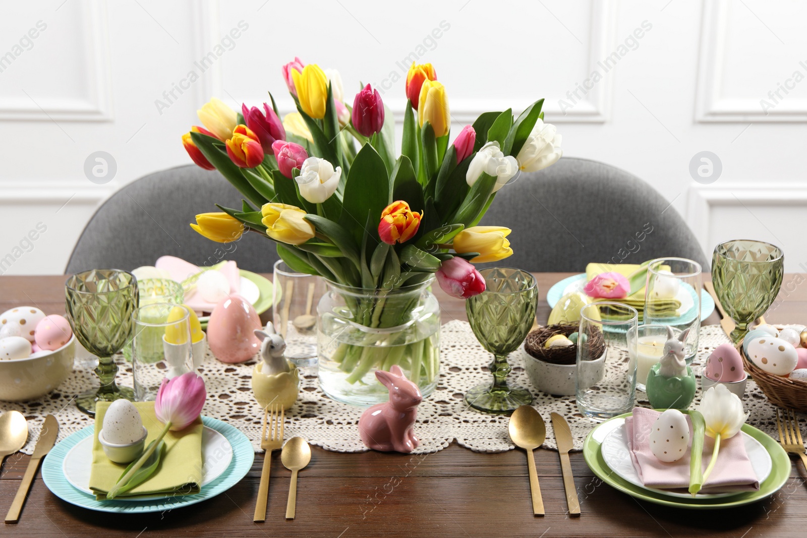 Photo of Festive table setting with beautiful flowers. Easter celebration