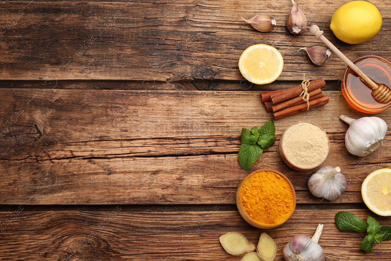 Photo of Flat lay composition with fresh products on wooden table, space for text. Natural antibiotics