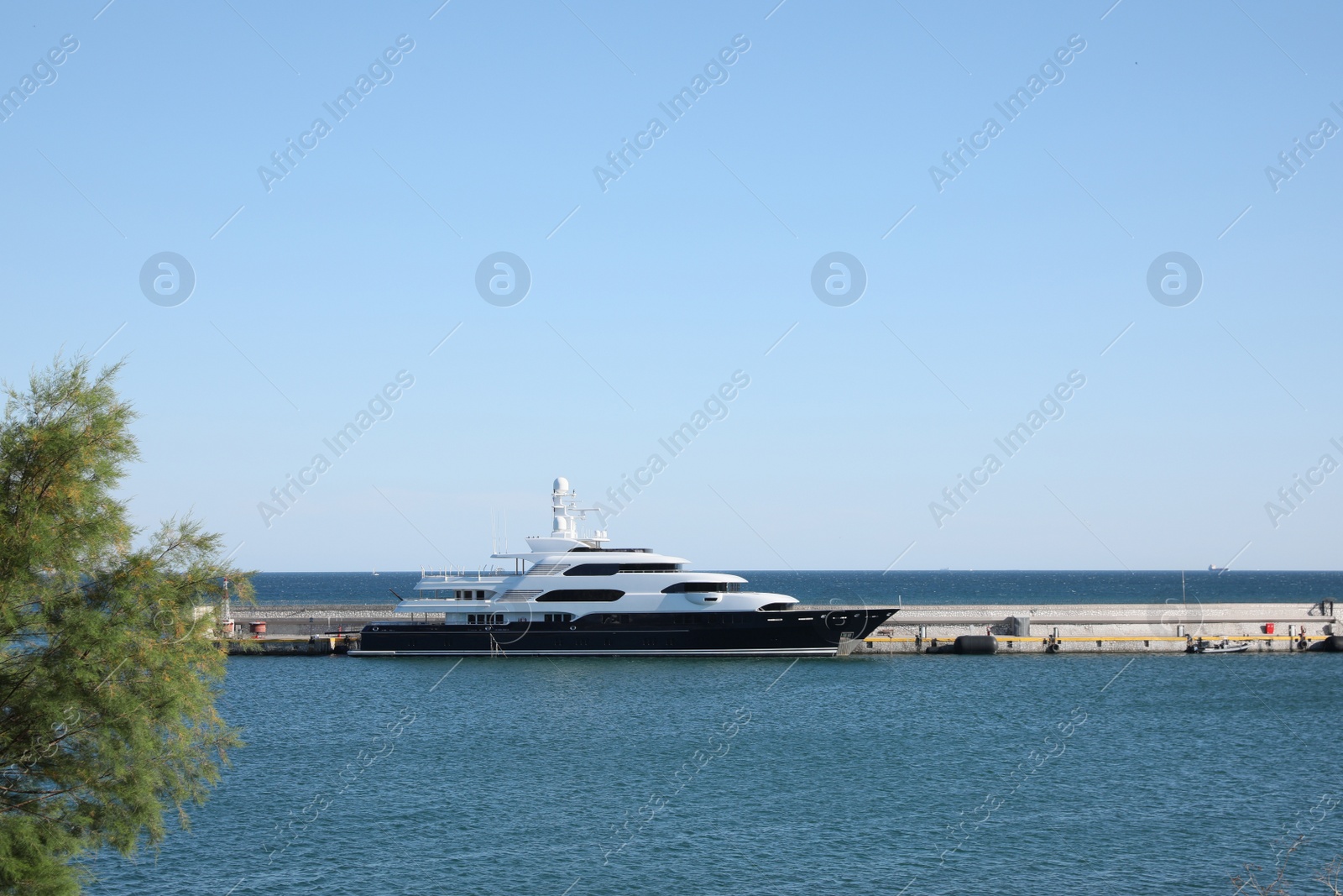 Photo of Modern ferry in sea port on sunny day