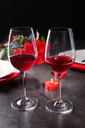 Photo of Beautiful place setting for romantic dinner on grey table