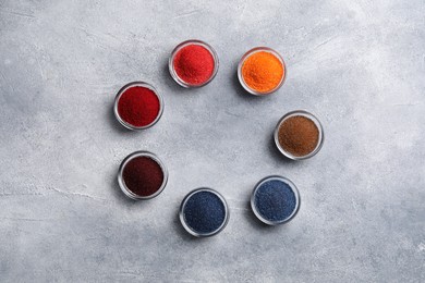 Photo of Different food coloring on light grey table, flat lay. Space for text