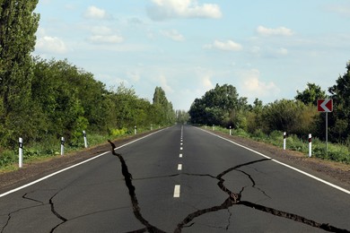 Large cracks on asphalt road after earthquake
