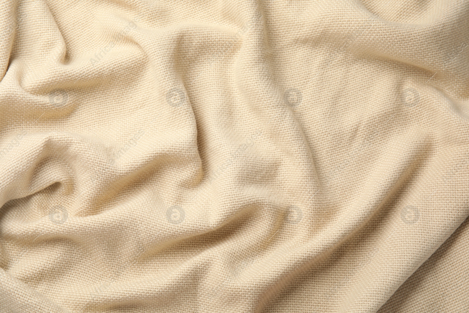 Photo of Soft warm beige plaid as background, closeup