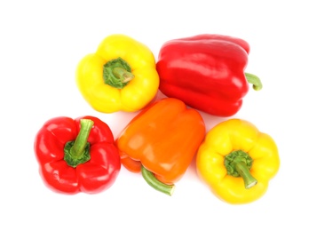 Fresh ripe bell peppers on white background, top view