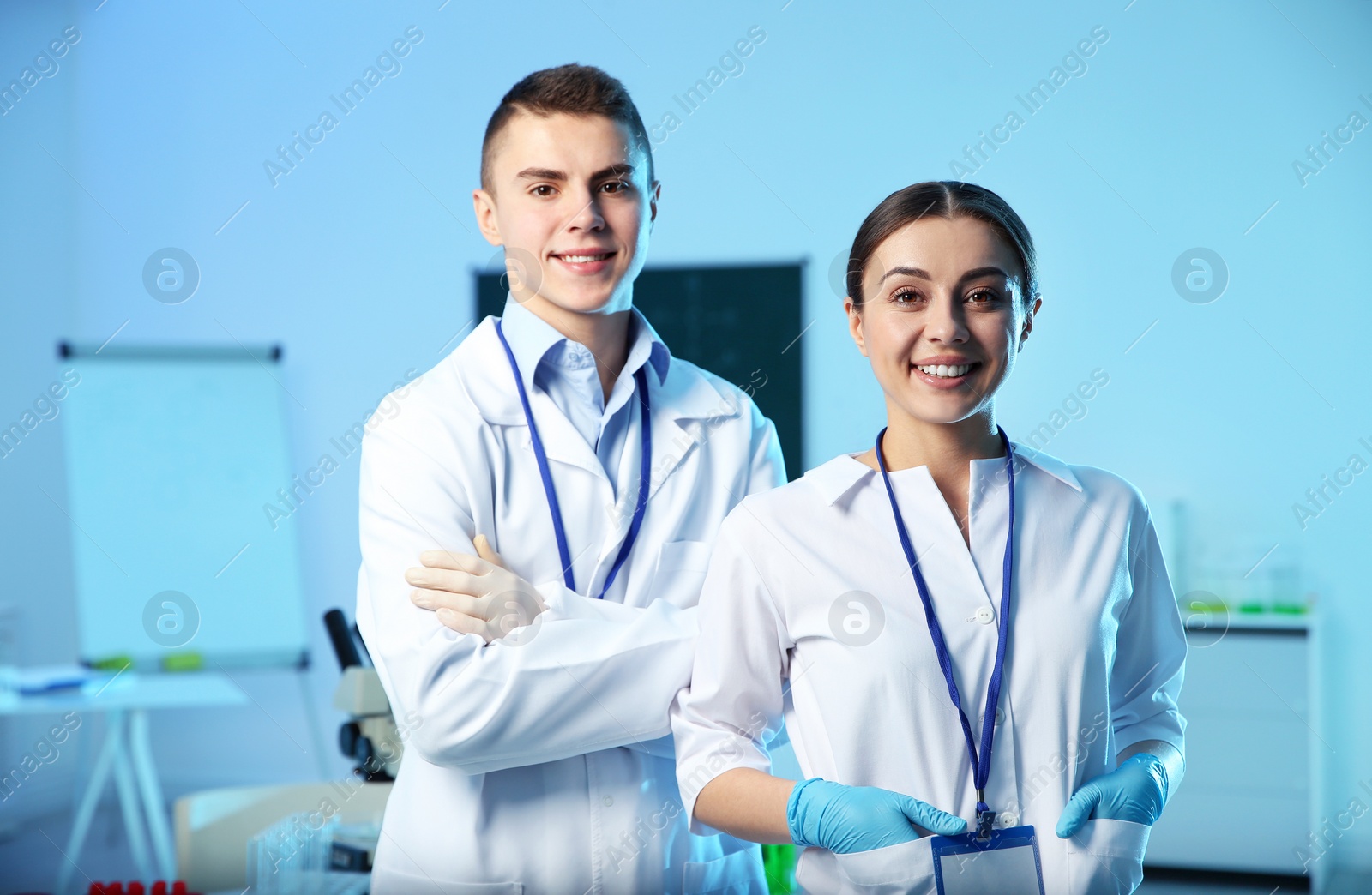 Photo of Portrait of young scientists in chemistry laboratory