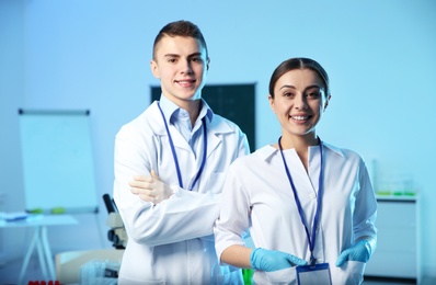 Portrait of young scientists in chemistry laboratory