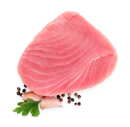 Raw tuna fillet with spices on white background, top view