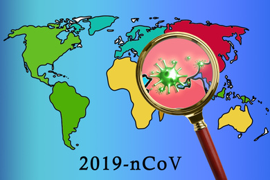 Image of Magnifying glass and illustration of world map. Coronavirus outbreak
