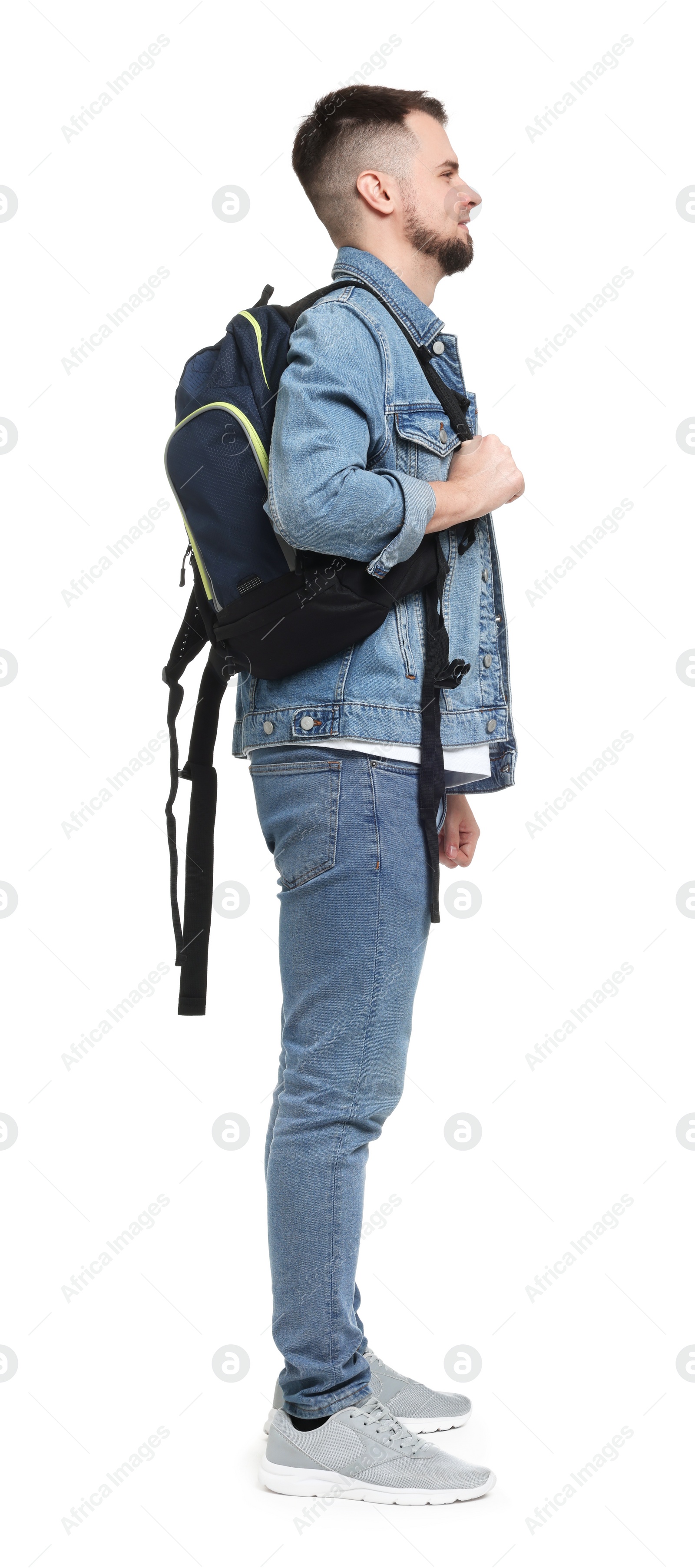 Photo of Man with backpack in denim clothes isolated on white