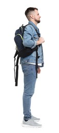 Man with backpack in denim clothes isolated on white