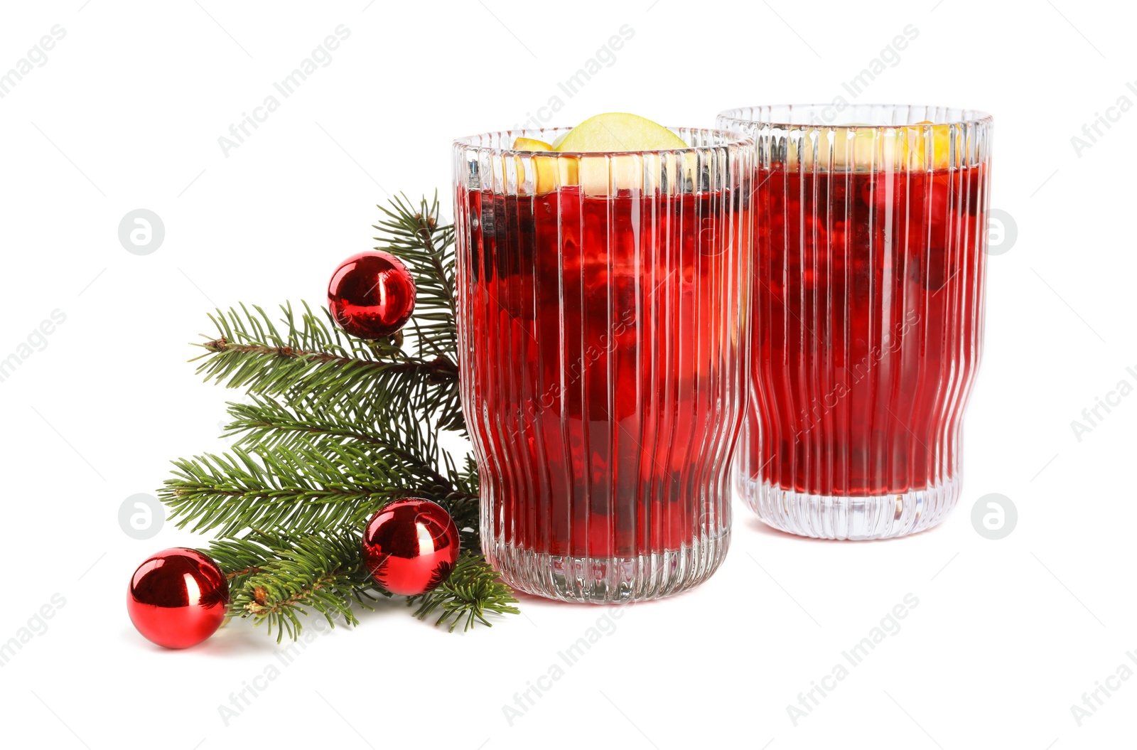 Photo of Aromatic Sangria drink in glasses and Christmas decor isolated on white