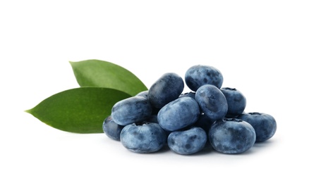 Photo of Heap of fresh ripe blueberries on white background