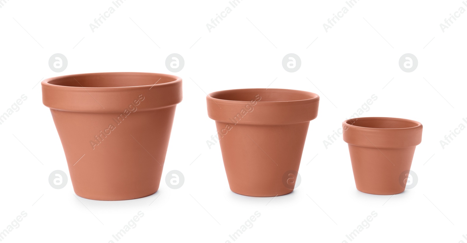 Photo of Stylish terracotta flower pots isolated on white