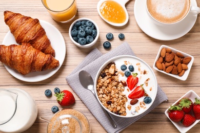 Buffet service. Tasty breakfast served on wooden table, flat lay