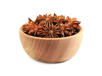 Wooden bowl with dry anise stars on white background