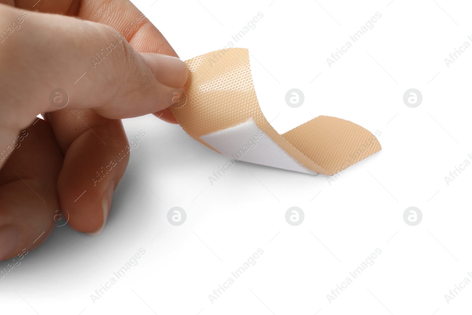 Woman putting sticking plaster on white background. First aid item Photo of Woman putting sticking plaster on white background. First aid item