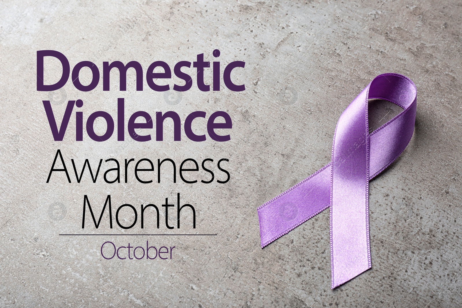 Image of Purple ribbon on grey background. Symbol of Domestic Violence Awareness