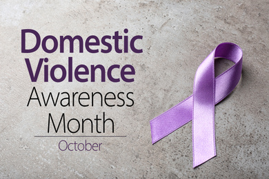 Purple ribbon on grey background. Symbol of Domestic Violence Awareness