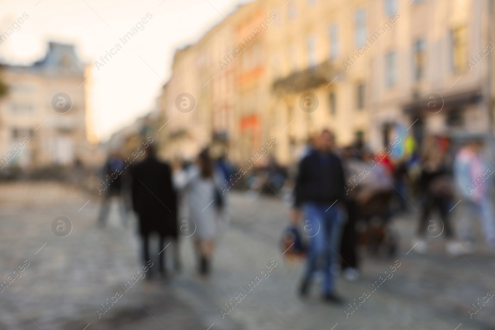 Photo of Blurred view of people walking on city street