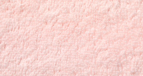 Photo of Texture of soft light pink fabric as background, top view