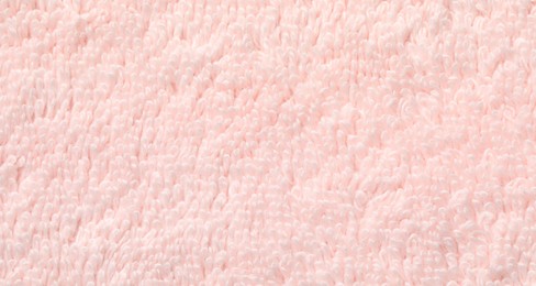 Texture of soft light pink fabric as background, top view