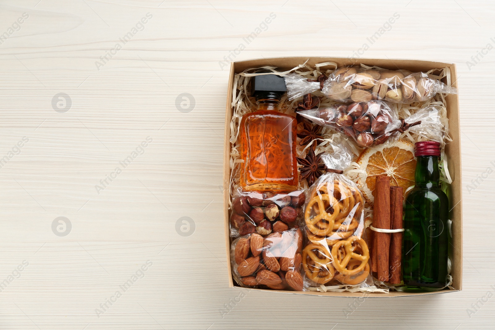 Photo of Stylish gift set on white wooden table, top view. Space for text