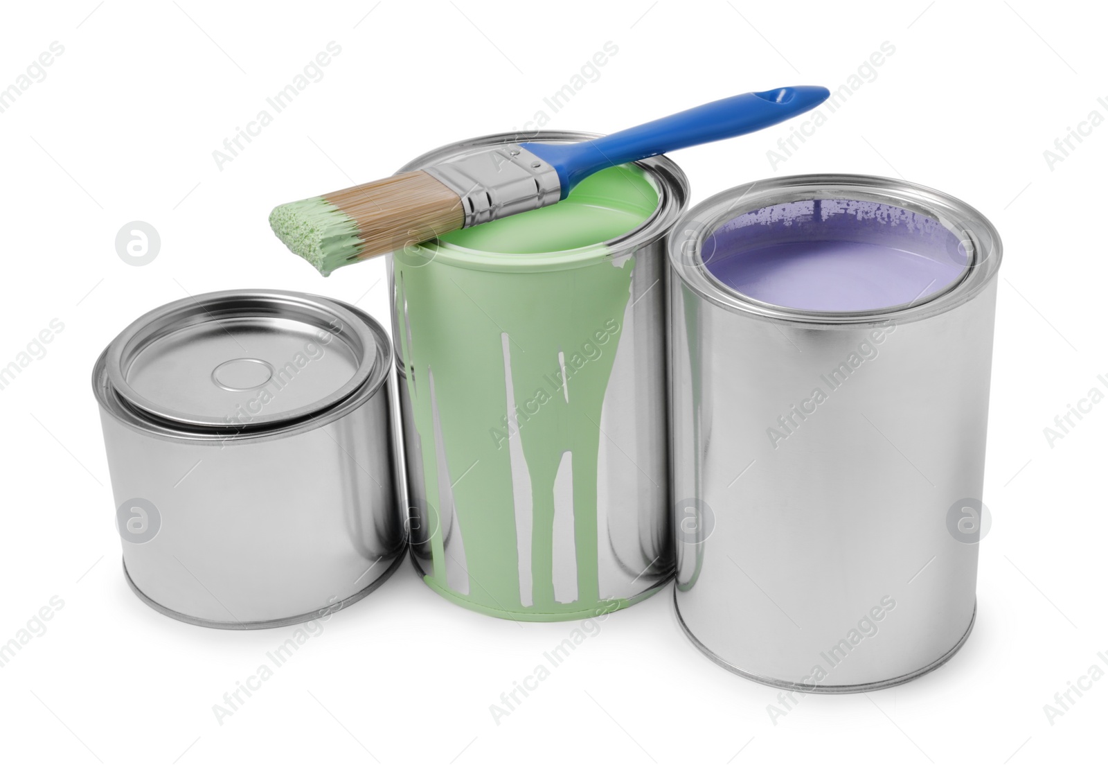 Photo of Cans with different paints and brush on white background