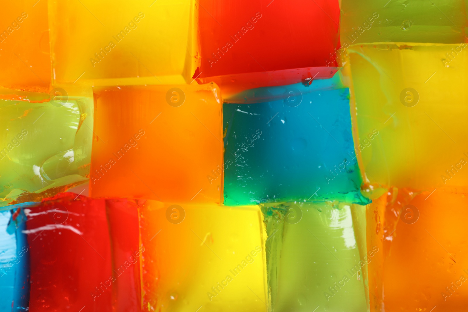 Photo of Tasty natural jelly cubes as background, top view