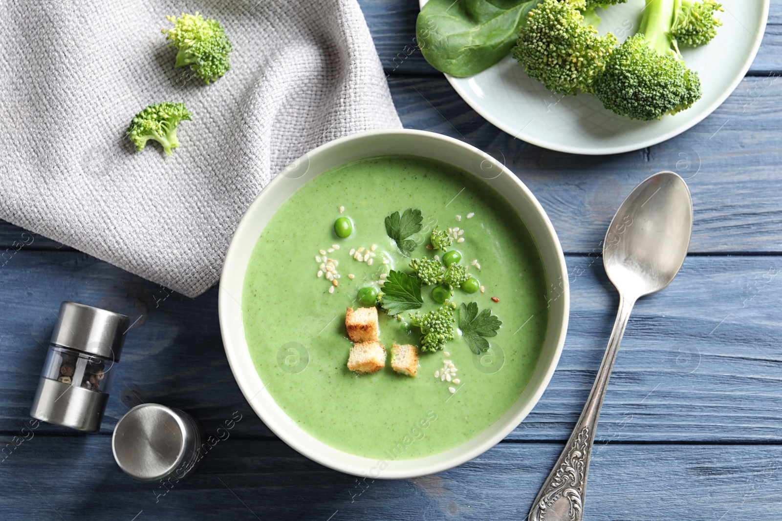 Photo of Fresh vegetable detox soup made of broccoli and green peas served on table, top view