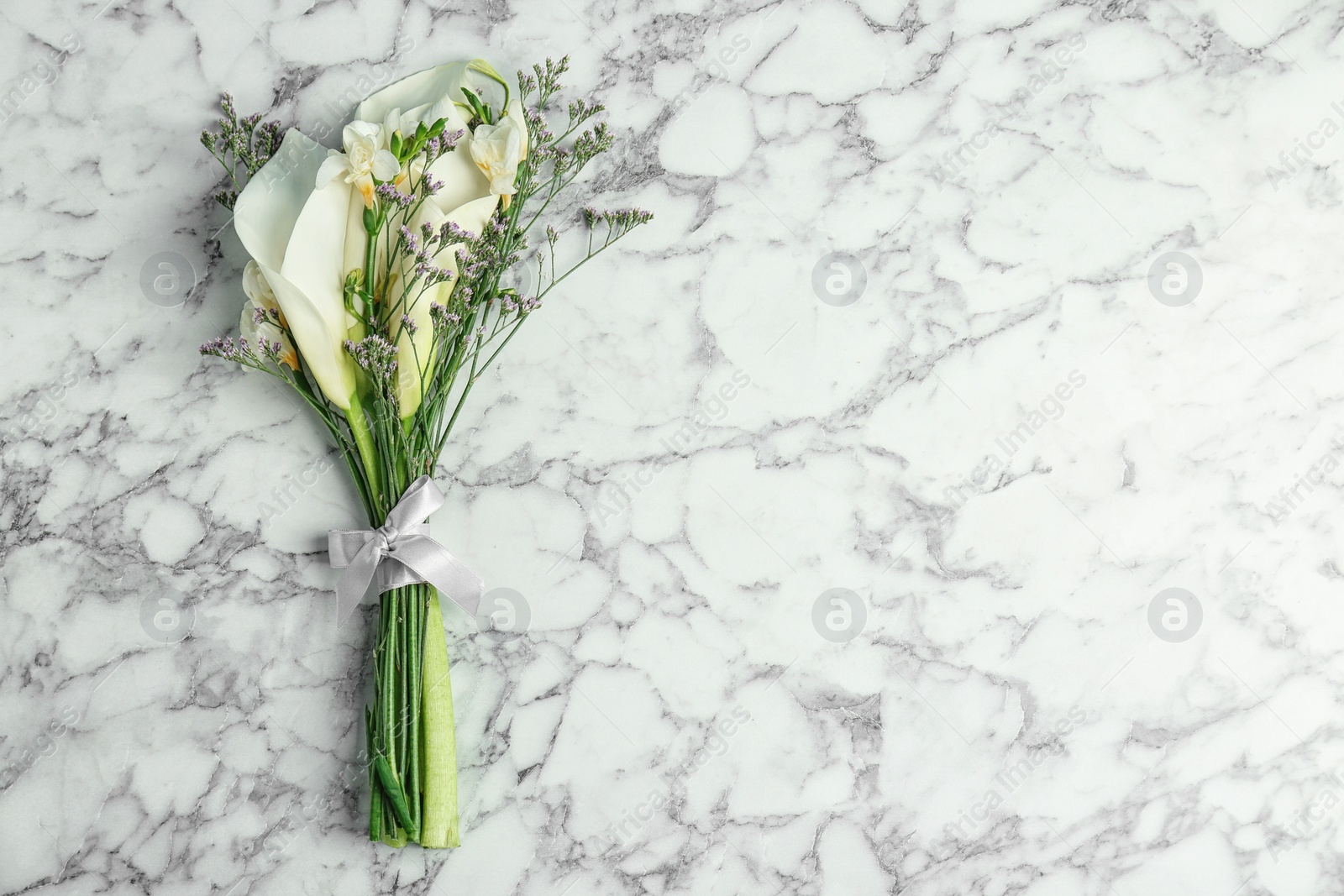 Photo of Bouquet of beautiful fragrant flowers on table