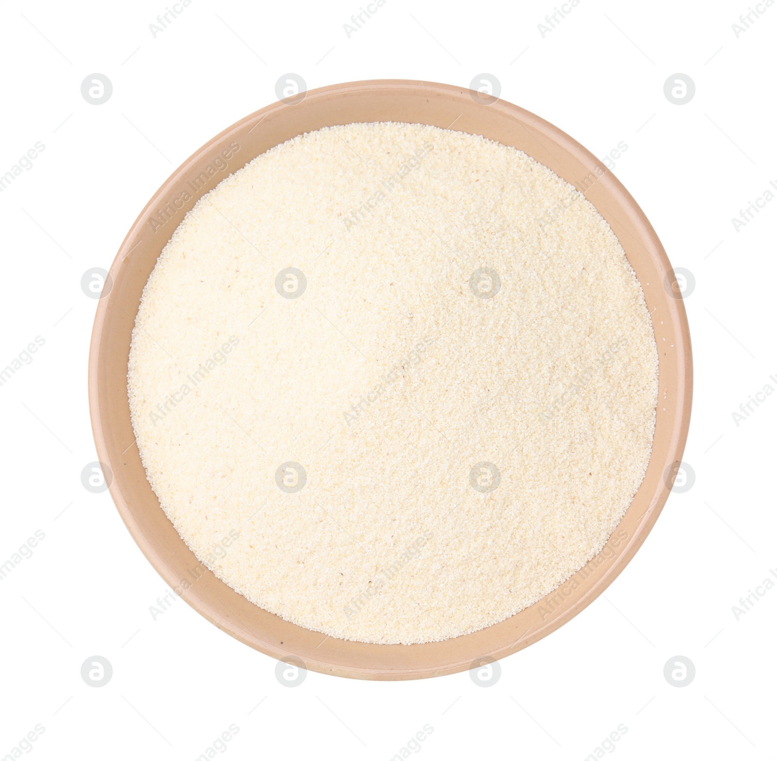 Photo of Bowl of uncooked organic semolina isolated on white, top view