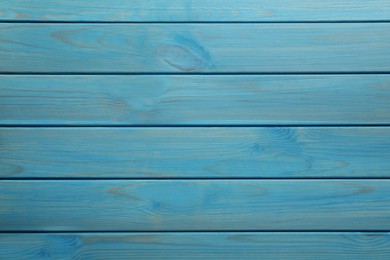 Texture of light blue wooden surface as background, top view