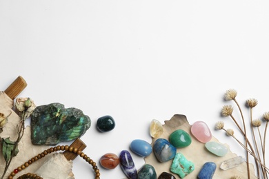 Photo of Composition with different gemstones on white background, top view