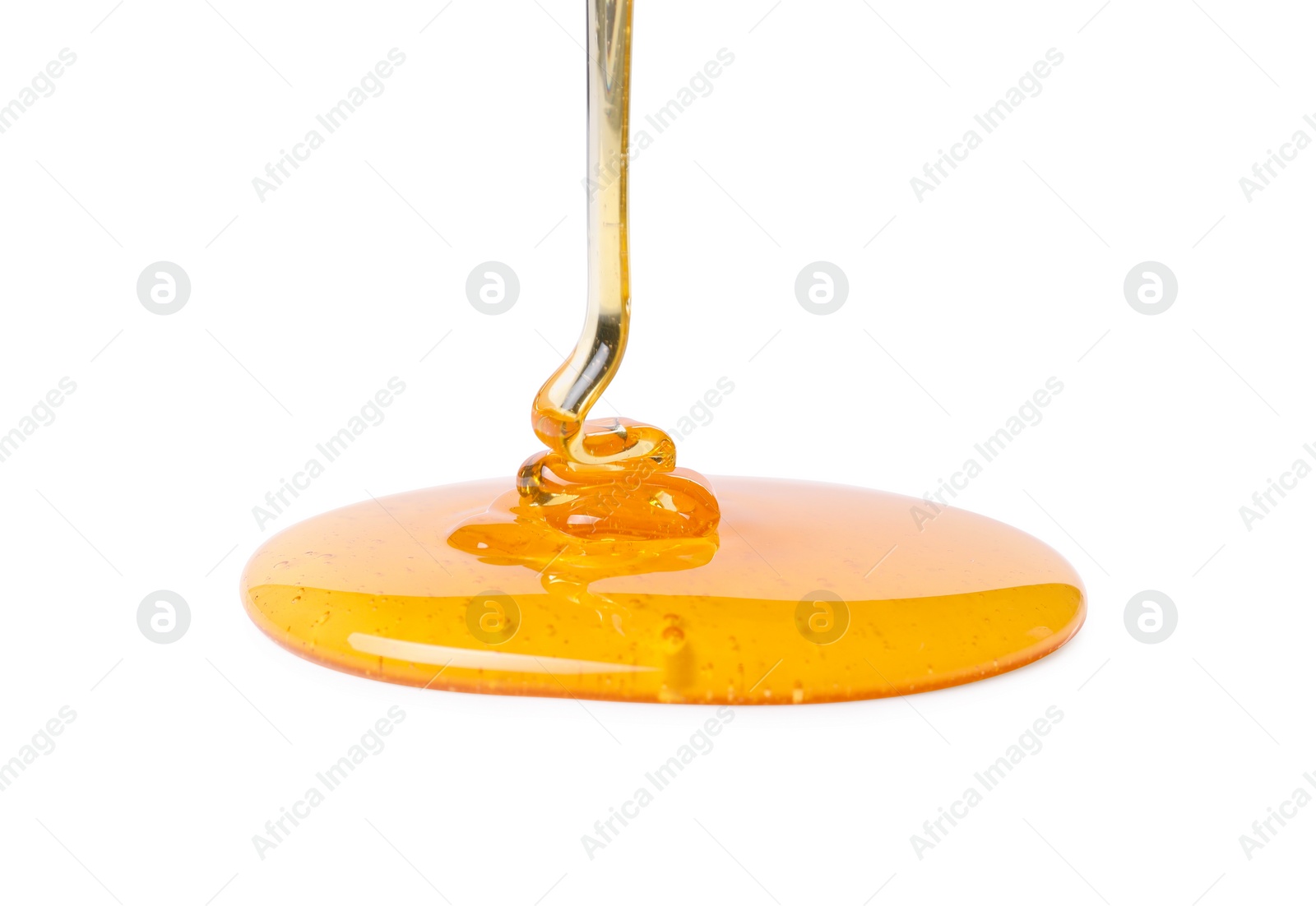 Photo of Pouring tasty natural honey isolated on white