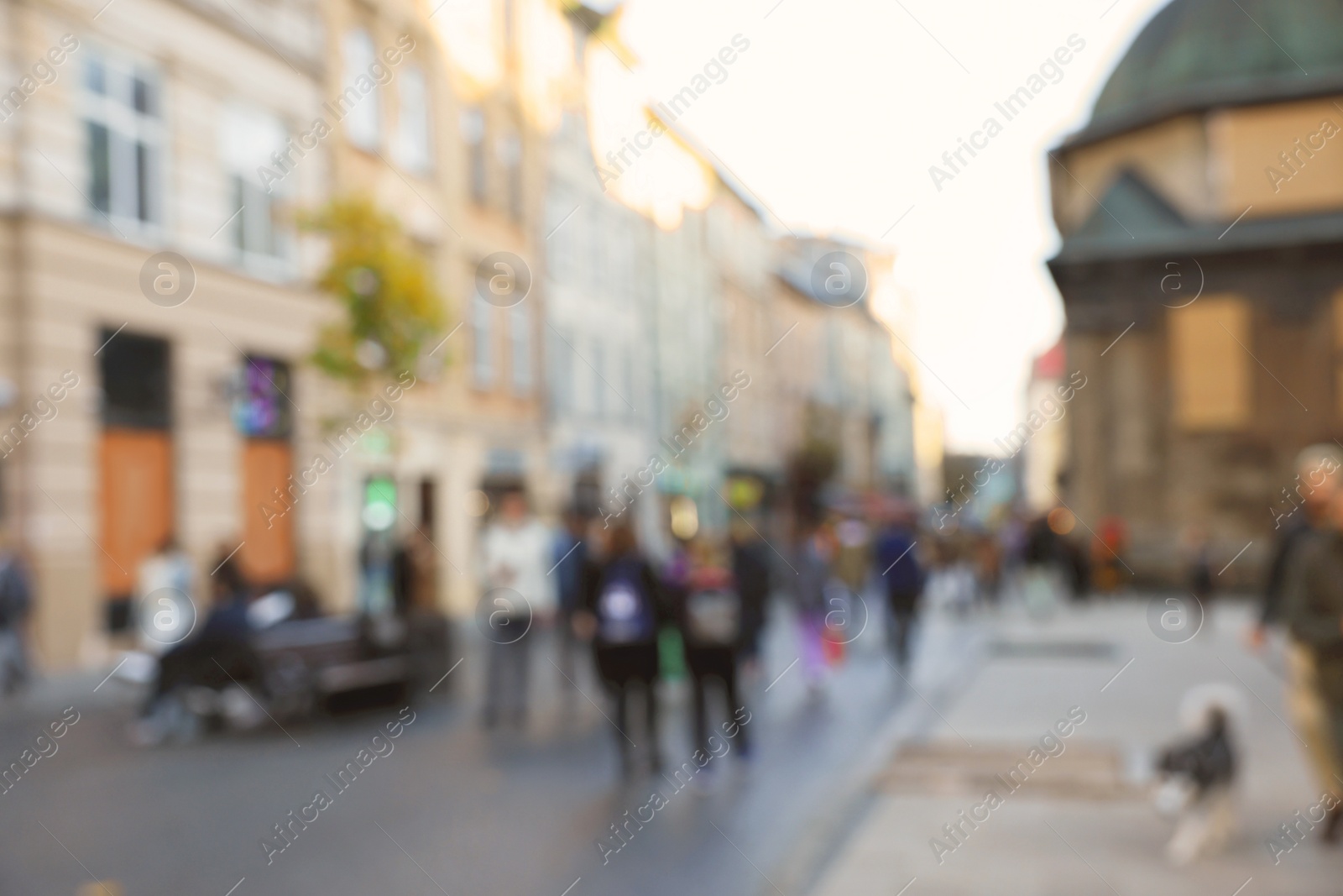 Photo of Blurred view of people walking on city street