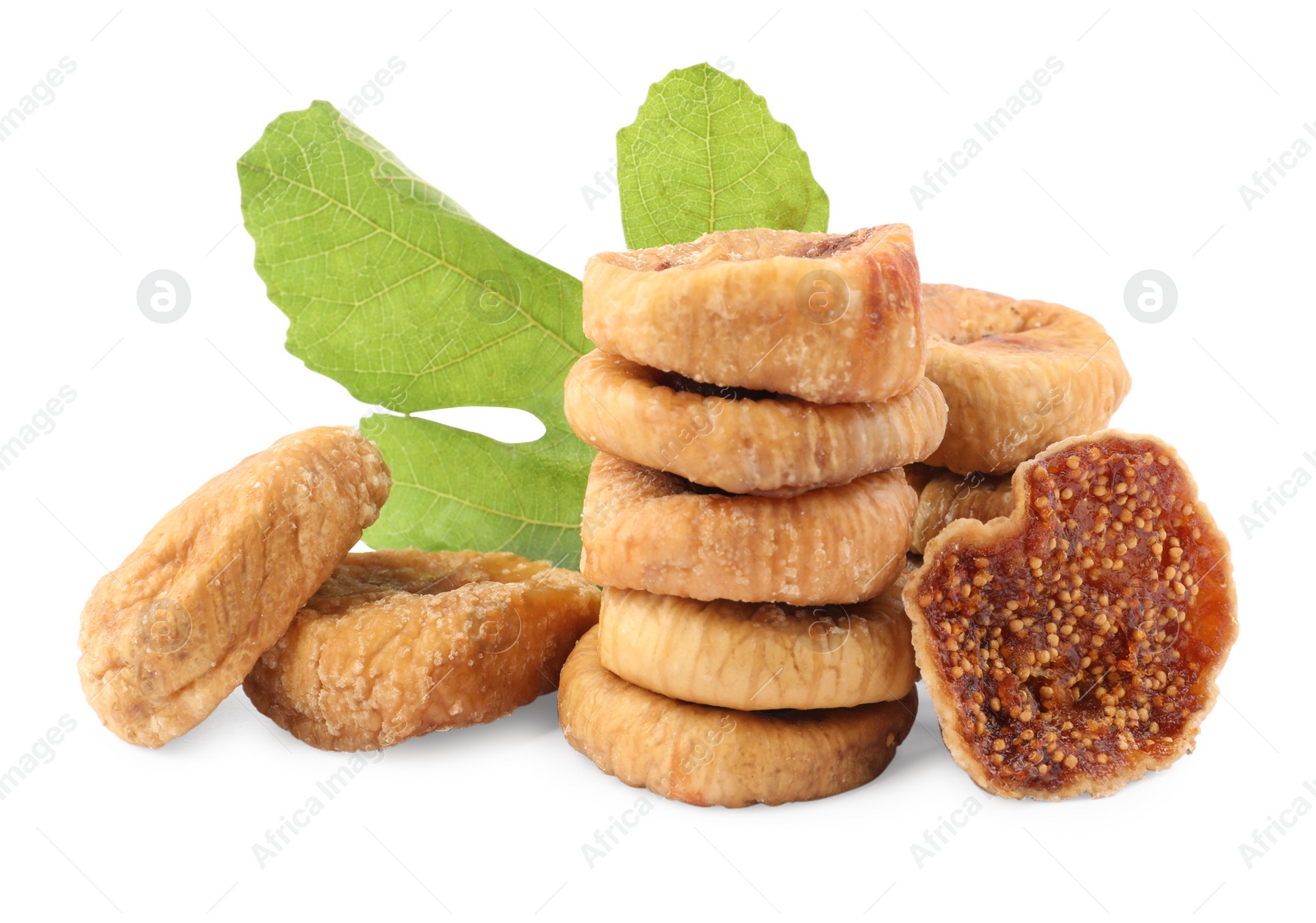 Photo of Tasty dried figs and green leaf isolated on white