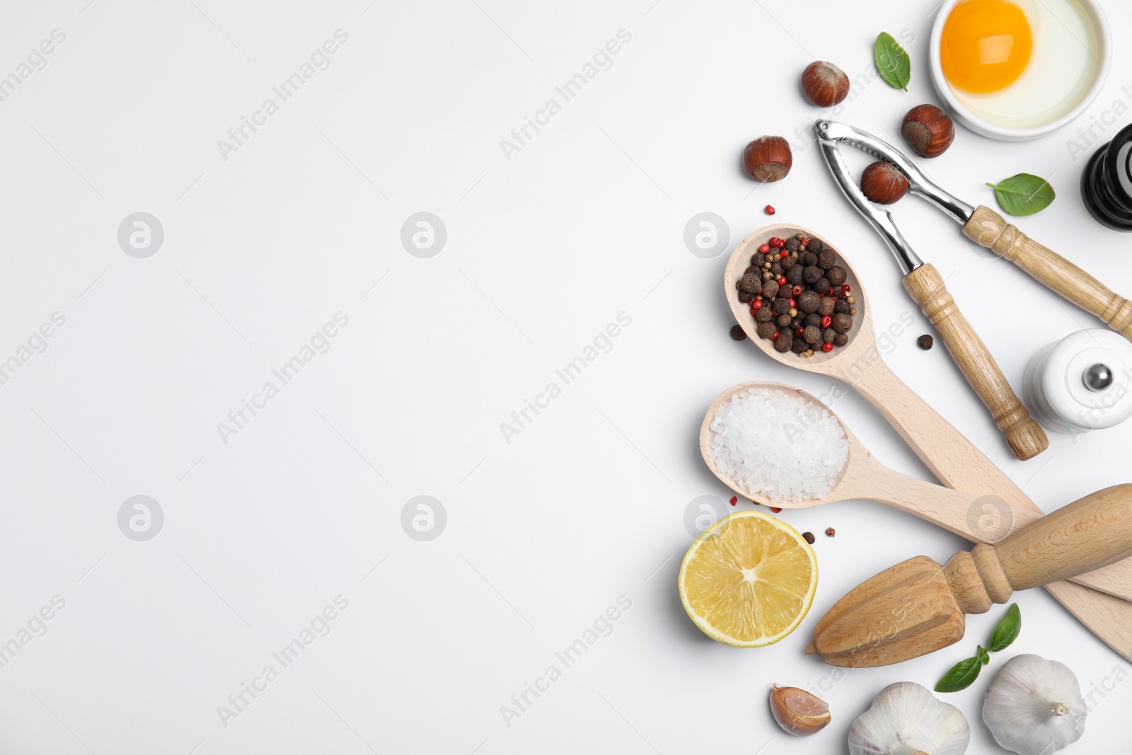 Photo of Composition with cooking utensils and fresh ingredients on white background, top view. Space for text