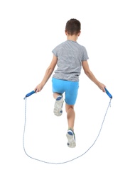 Active boy jumping rope on white background