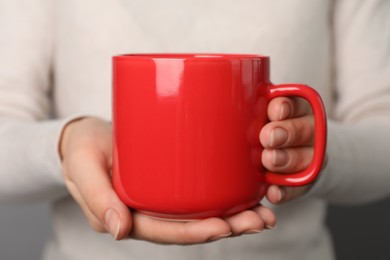 Photo of Woman holding mug of hot drink, closeup. Coffee Break
