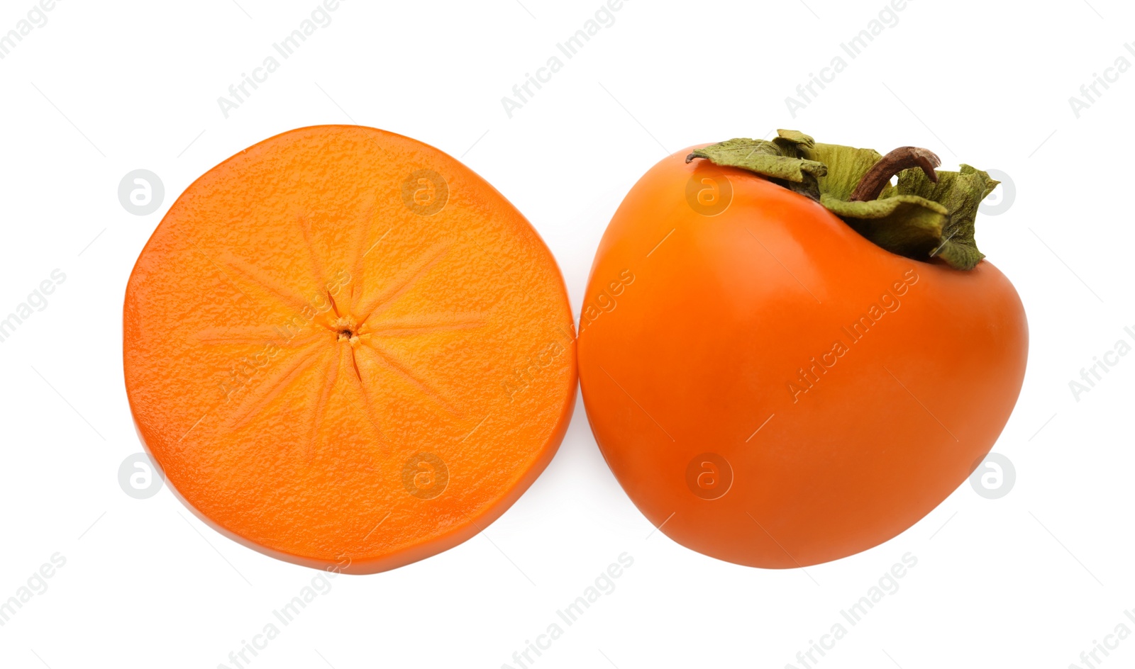 Photo of Whole and cut delicious ripe juicy persimmons on white background, top view