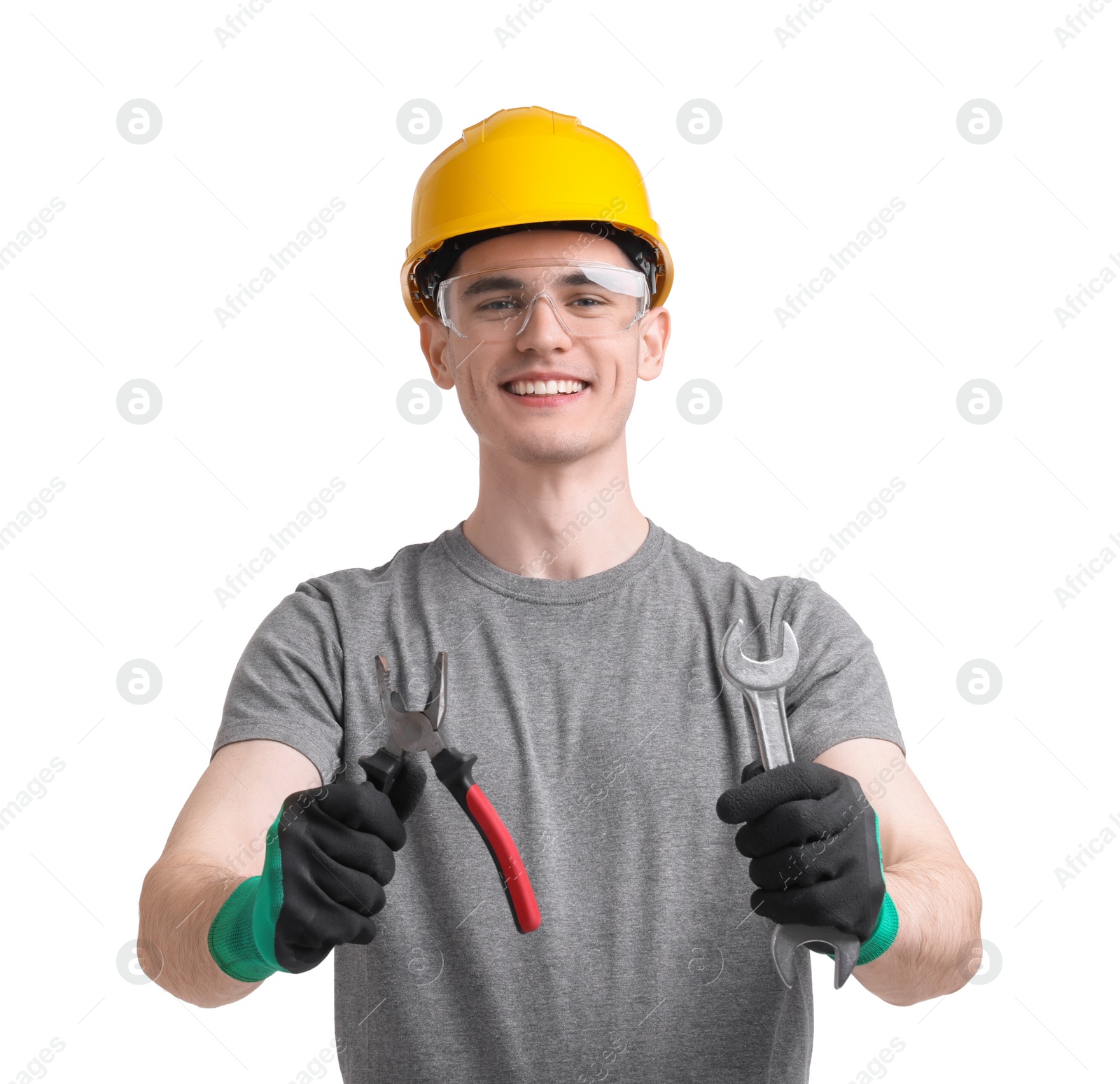 Photo of Young man holding pliers on white background